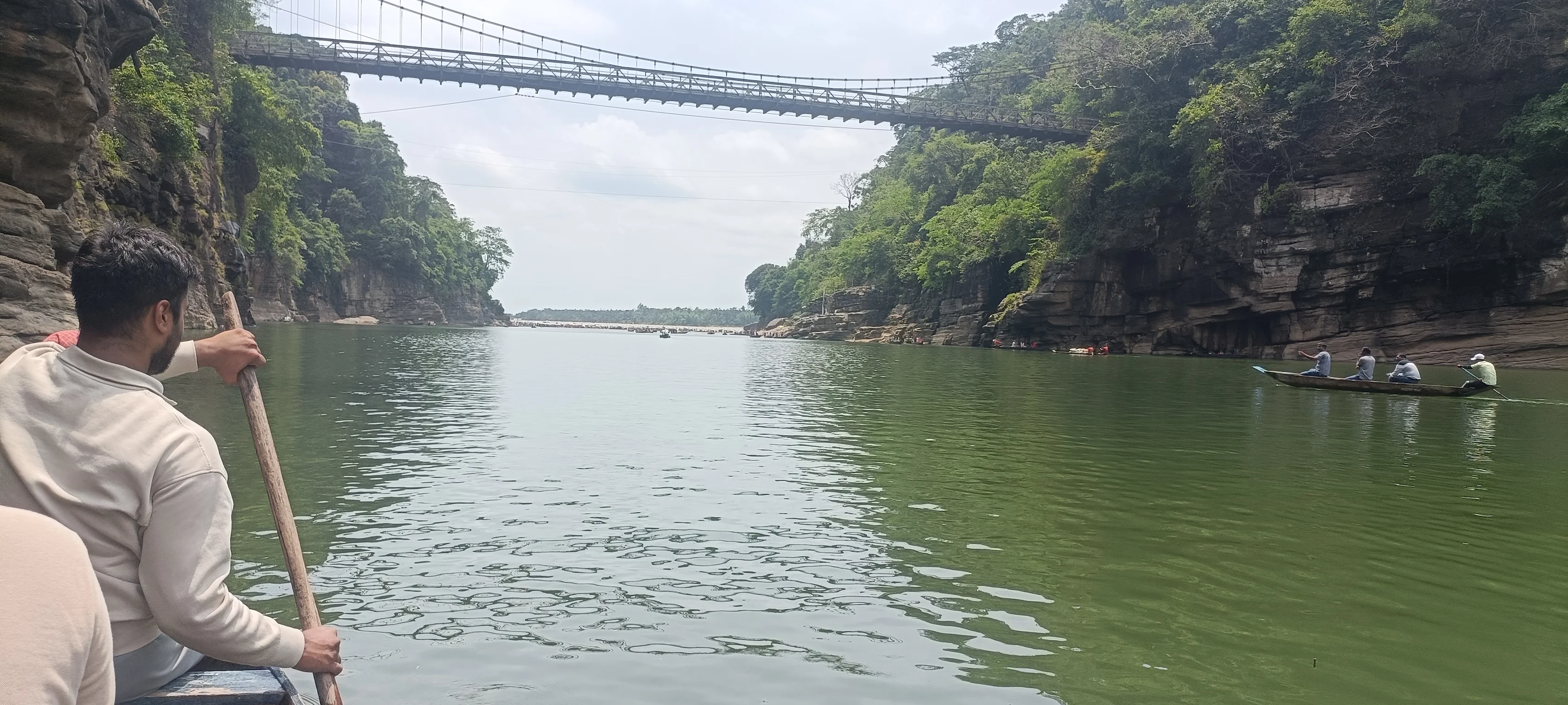 Dawki's crystal-clear Umngot River — boats float above the transparent riverbed